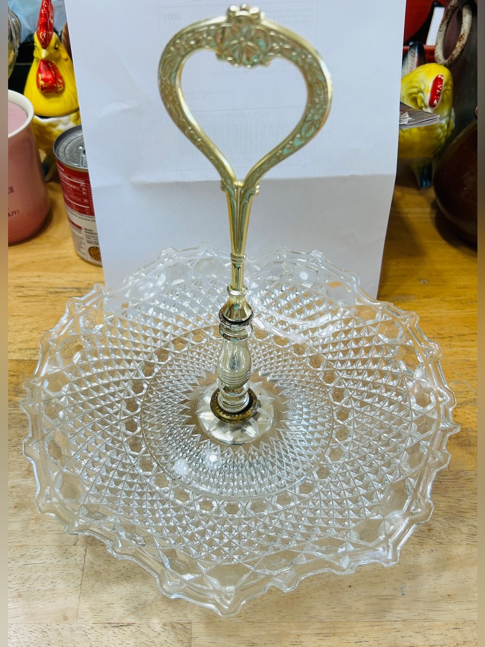 Vintage serving dish with goldtone handle.
